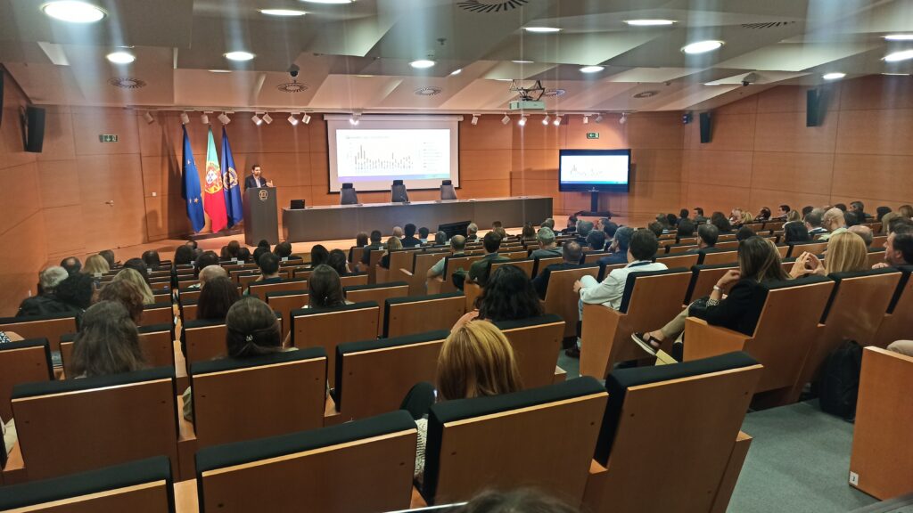 group of people in a conference room attending to a presentation