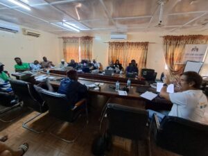 geoup of people discussing over a table in a room